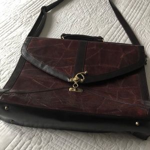 Genuine leather burgundy brief case.